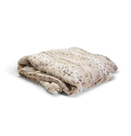 Folded plush snow leopard faux fur throw, beige and light brown with subtle patterns. Available in standard and oversized sizes.
