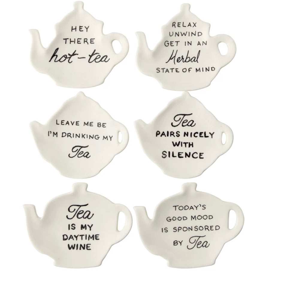 Set of six white teapot-shaped stoneware dishes, each with a unique black tea saying; available in 4-inch size.