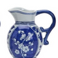 The Canton Small Pitchers: blue and white ceramic, floral Canton patterns, curved handle. Available in multiple small sizes.