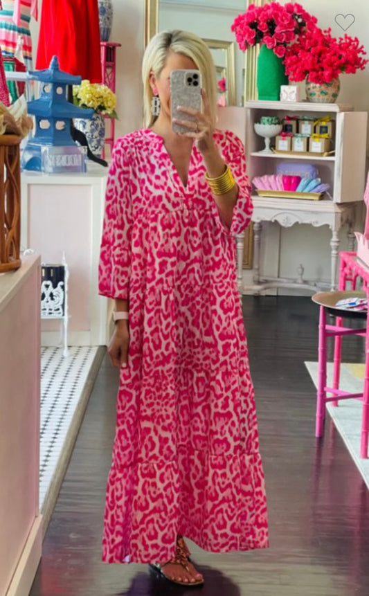 This Hot Pink Animal Print Long Sleeve Dress is available in sizes Small, Medium, and Large.