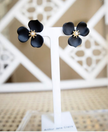 Black petal flower stud earrings with gold and pearl centers. Available sizes: small, medium, large.