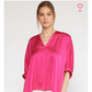 This is a bright pink Satin V Neck Plus Top with flowing sleeves. The top is available in plus sizes.