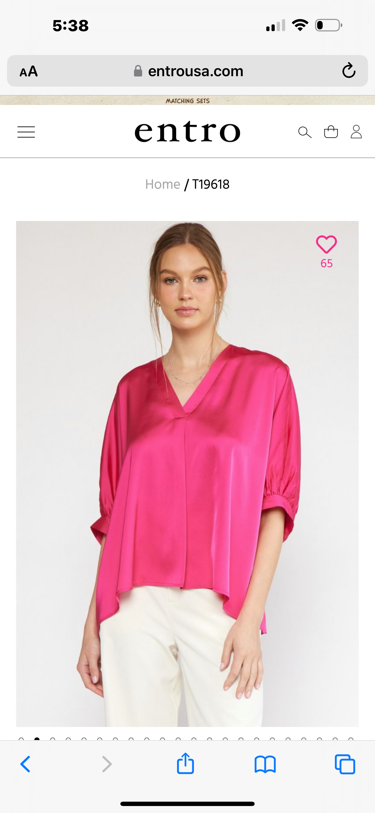 This is a bright pink Satin V Neck Plus Top with flowing sleeves. The top is available in plus sizes.