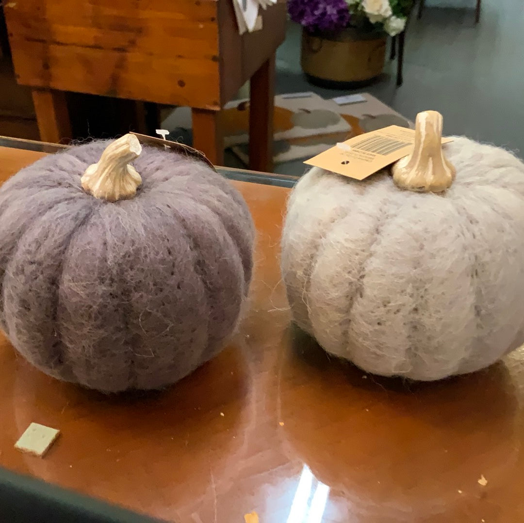 Small purple and light gray wool felt pumpkins with tan stems.