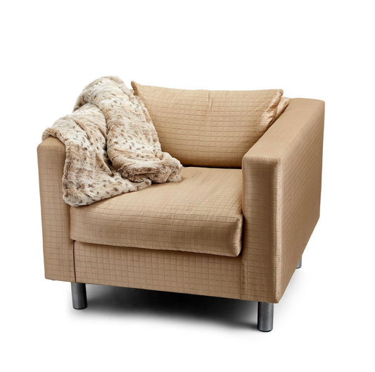 Plush Snow Leopard Faux Fur Throw, available in 50"x60" and 60"x80", shown draped over an armrest.