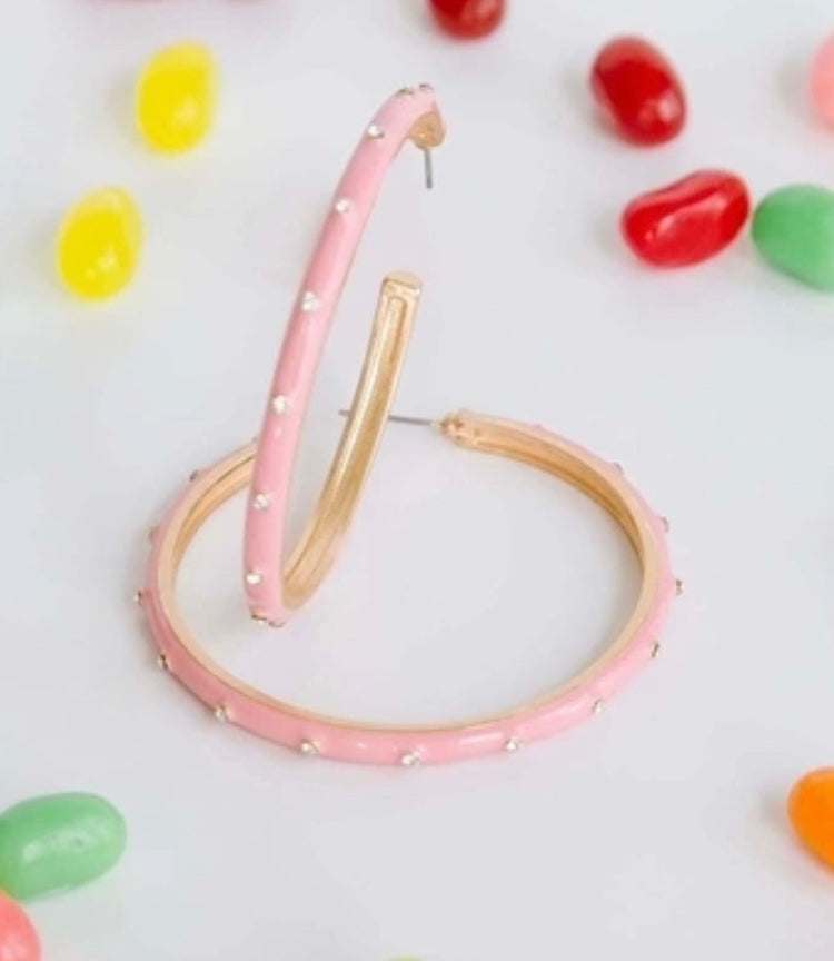Michelle McDowell Earrings: large pink hoops with small white dots. Available in large size.
