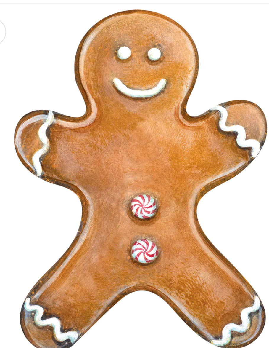 Gingerbread Man Table Accent with white icing and peppermint buttons.