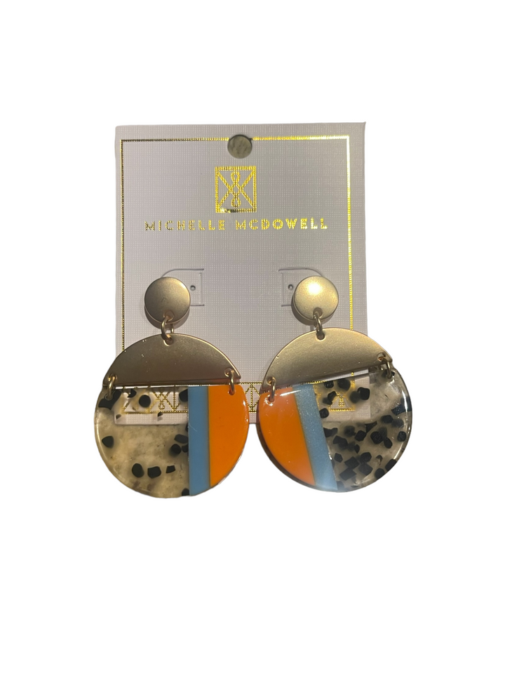 Michelle McDowell round drop earrings with gold hardware, colorful resin disks in geometric and animal prints. Sizes: S, M, L.