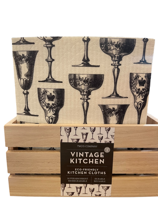 Set of biodegradable, reusable cloths with black vintage glassware pattern, available in multiple sizes. Label: "Vintage Kitchen.