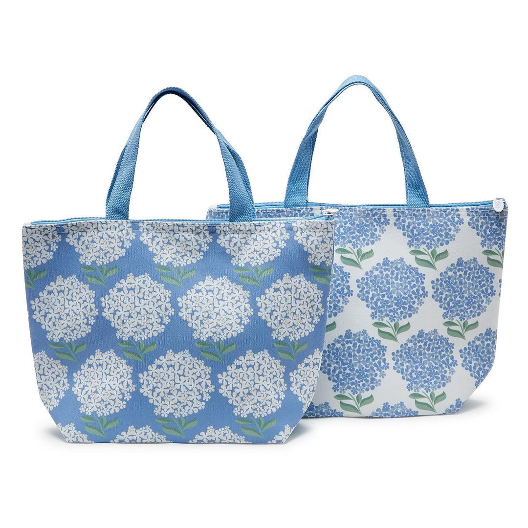 Hydrangea Thermal Lunch Totes with blue handles, in blue or white backgrounds; available in standard and large sizes.