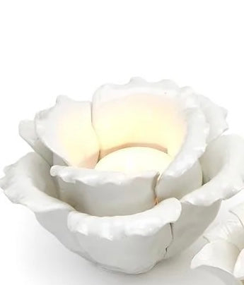 White ceramic tealight holders shaped like blossoms, available in small (3"), medium (4"), and large (5") sizes.