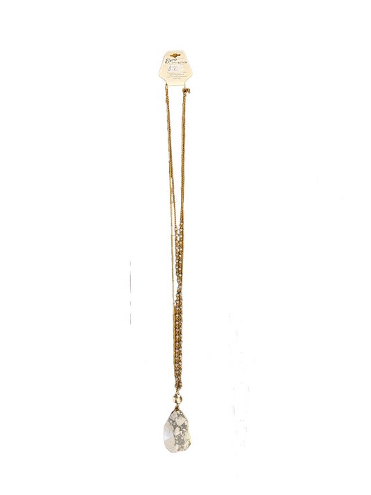 White Granite Necklace Euro Collection: long gold chain, white stone pendant with gray veins. Available in 16", 18", 20".