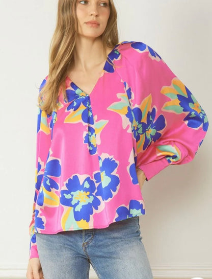 Pink Flower Blouse: vibrant satin, pleated neckline, long sleeves, bold pink floral prints. Available in sizes XS–XL.