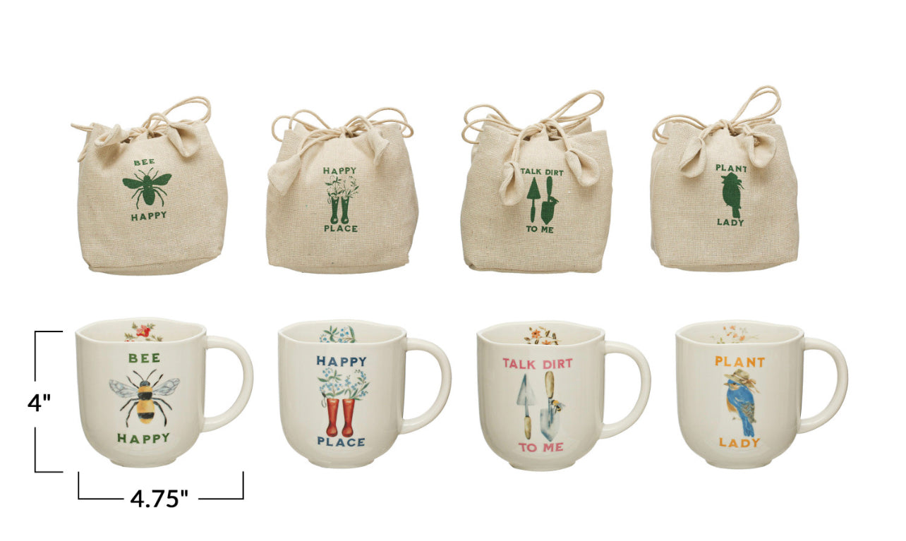 This set includes four canvas drawstring bags and four 4-inch Stoneware Mugs. Each item is adorned with unique botanical and bee-themed designs along with phrases such as "bee happy" and "talk dirt to me." The mugs are 4 inches in size, perfect for a generous cup of tea or coffee.