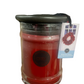 Partially burned Bridgewater Welcome Home Candle in red jar with dark lid and wreath label; available in multiple sizes.