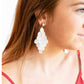 Mira Earrings: 3-inch white teardrop statement earrings, shell-like with multiple beads. Available in standard size.