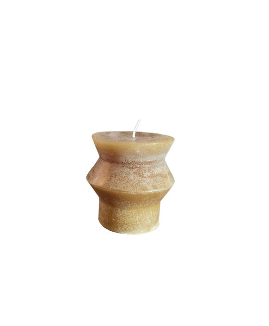 Tan, geometric-shaped Unscented Totem Pillar Candle with a white wick and textured, weathered surface. Available in multiple sizes.