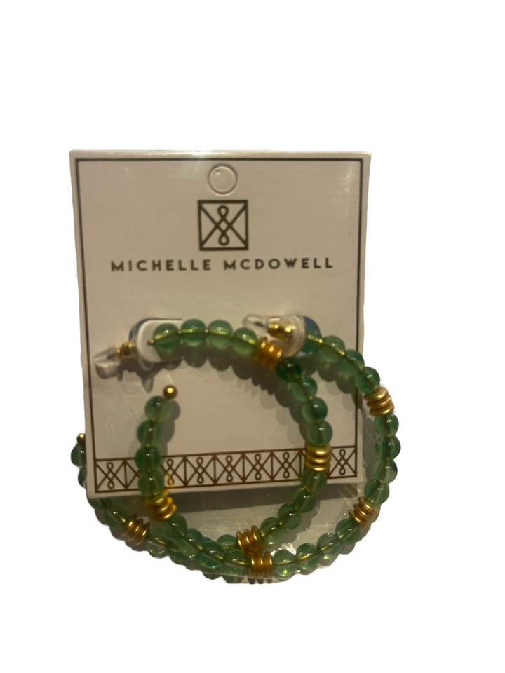 Green beaded hoop earrings with gold accents. Available sizes: Small, Medium, Large.