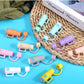 Colorful mini plastic projectors available in vibrant shades of orange, blue, and purple. Available sizes not specified.