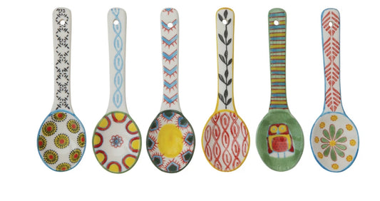Six hand-painted stoneware spoons, each with a unique pattern; available in small and large sizes.
