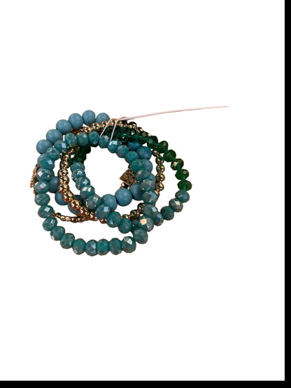 The Mandy Bracelet: bead bracelets in blue, teal, gold, and blush with white string tag. Available in S/M/L.