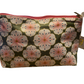 Travel Pouch with pink zipper, floral pattern on green, small side tag. Available sizes: Small, Medium, Large.