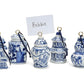 Set of five blue & white hand-painted ornaments with gold rings, black strings; one is a place card holder. Sizes: assorted.
