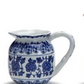 White porcelain small pitchers with blue floral and geometric designs, curved handle. Available in 6oz and 10oz sizes.