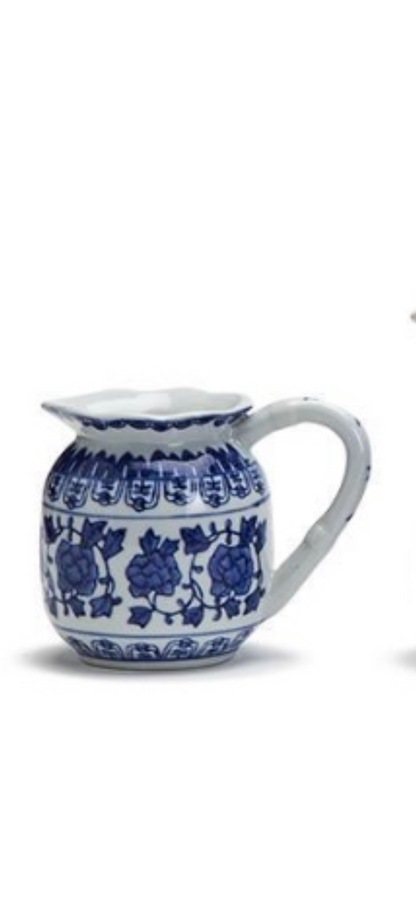 White porcelain small pitchers with blue floral and geometric designs, curved handle. Available in 6oz and 10oz sizes.