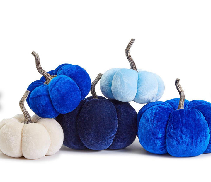 Five velvet pumpkins in blue, navy, and cream.