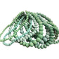 Glass Beaded Strand Bracelet with multiple coils of round and faceted turquoise and green beads. Available in S, M, L.