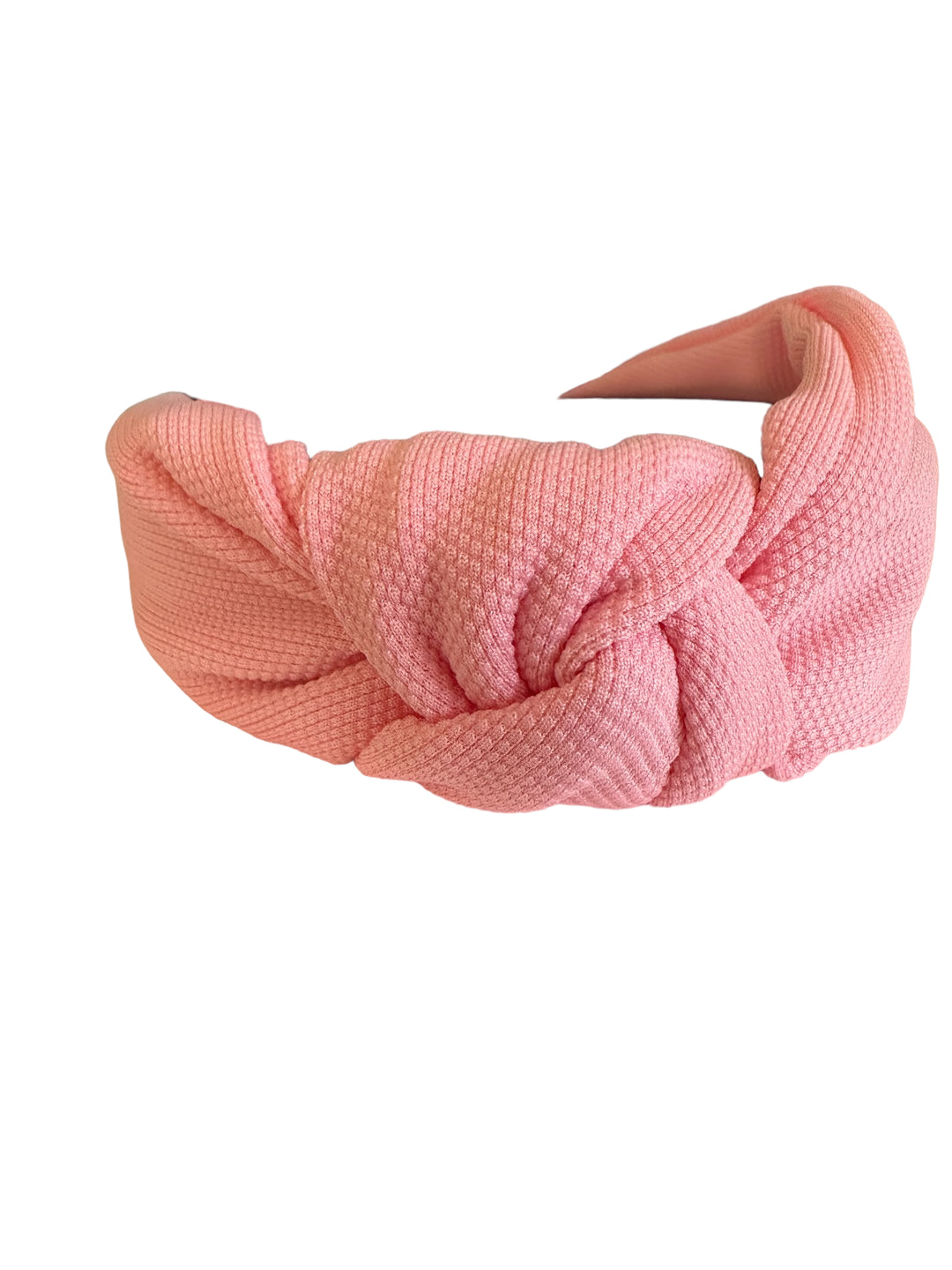 Pink textured fabric headband with a front knot. Available sizes: S, M, L.