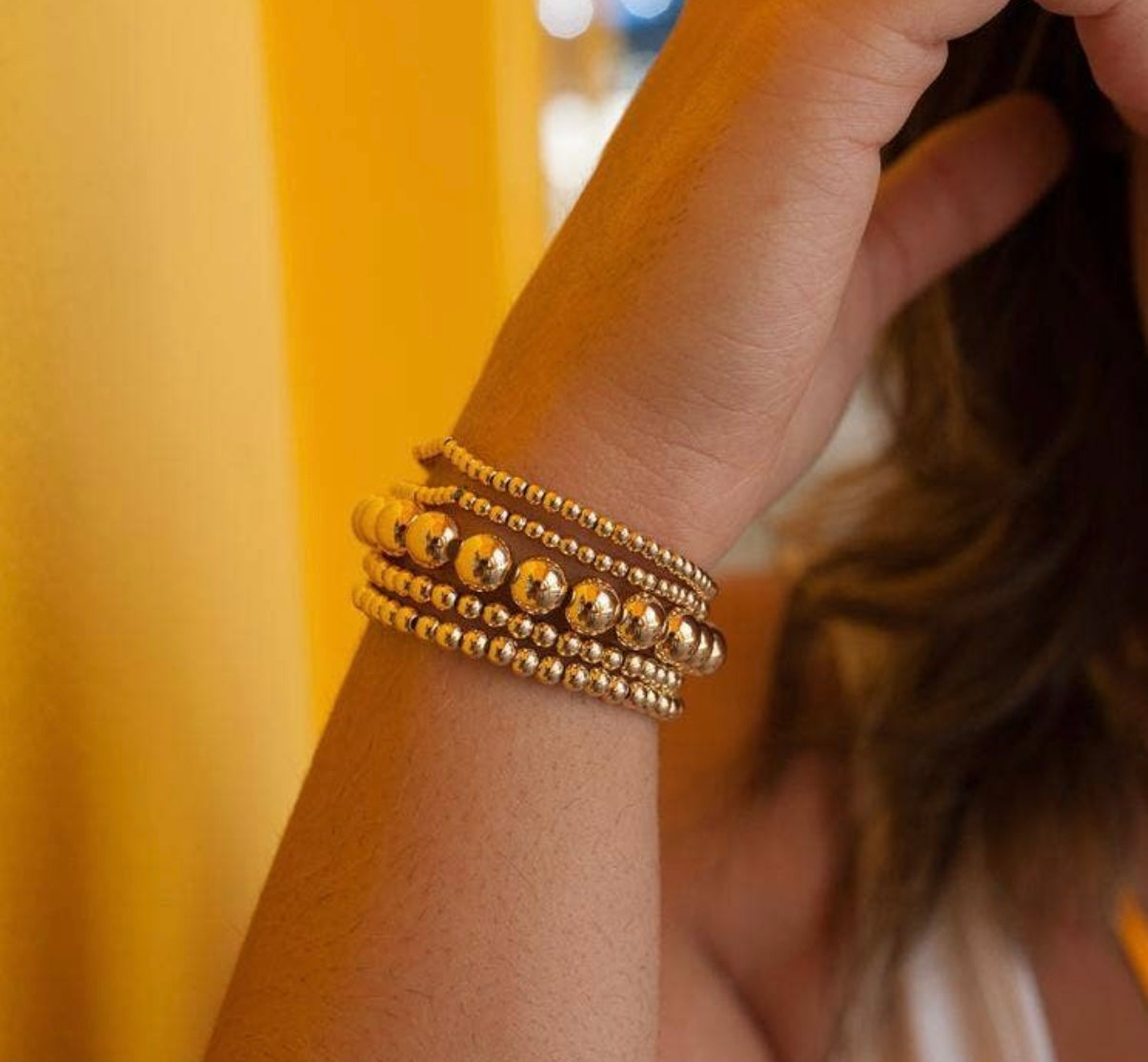 18K filled gold bead bracelets in various designs and textures. Available in standard women's wrist size.