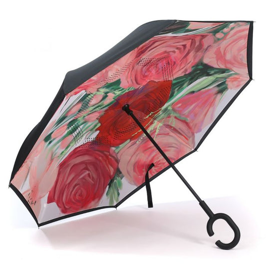 The Upside Down Umbrella has a black exterior, floral underside, wind-resistant build, C-handle. Available in multiple sizes.
