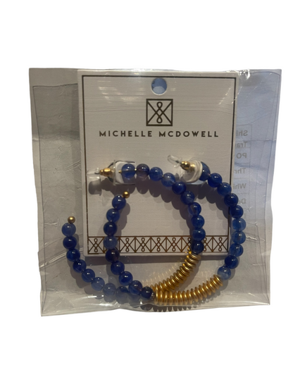 Michelle McDowell beaded hoop earrings with blue beads and gold accents. Available sizes: small, medium, large.