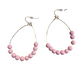 Thin gold hoop earrings with eight matte pink beads on the lower half. Available in small, medium, and large sizes.