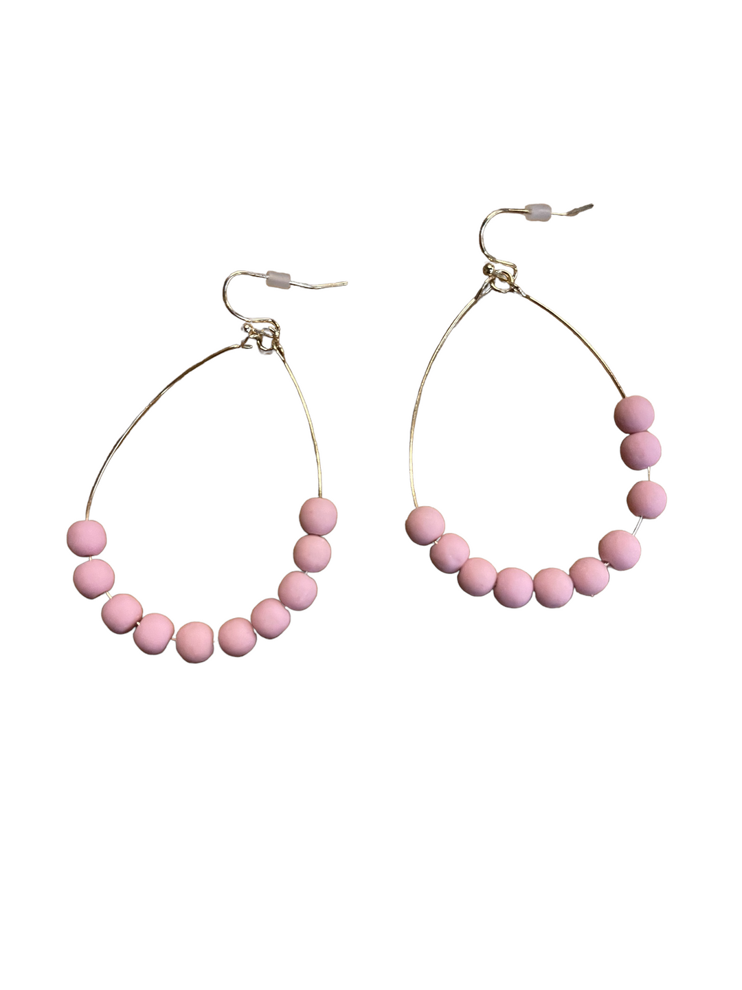 Thin gold hoop earrings with eight matte pink beads on the lower half. Available in small, medium, and large sizes.