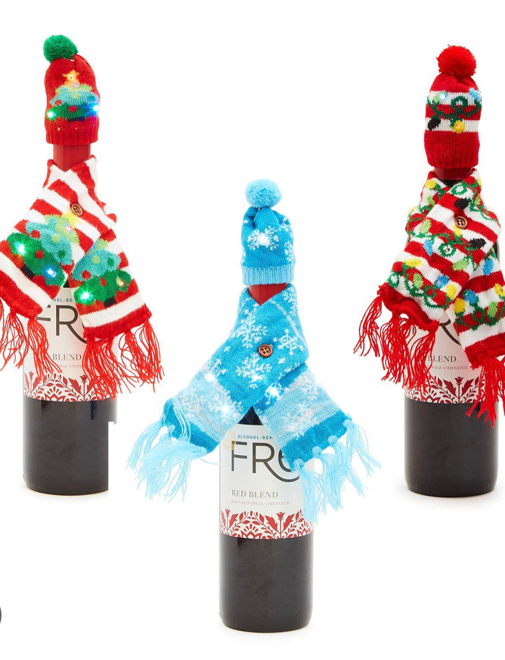 Three Merry and Bright knit scarf and bottle cover sets featuring miniature knit hats, holiday-patterned scarves, and LED lights.