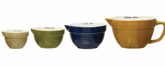 Set of 4 stoneware measuring cups: 1/4, 1/3, 1/2, and 1 cup in beige, green, blue, yellow; measurement labels inside.