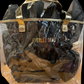 Clear waterproof tote bag with gold handles, trim, black tissue, and "EVERLEE JANE" in gold. Available in S, M, L.