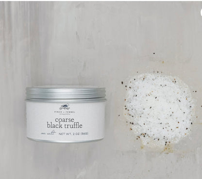 Open tin labeled "Coarse Black Truffle Salt" with infused coarse salt crystals. Available in 2 oz and 4 oz sizes.