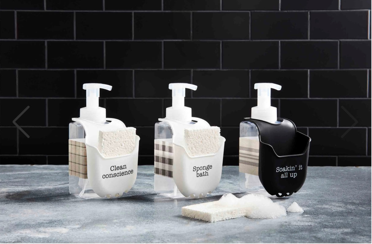 This set consists of three Sponge Holders with Soap Dispensers, one in black and two in clear. Each piece is equipped with a silicone sink sponge holder for easy storage. The dispensers also feature witty labels for an added touch of unique charm. The holders come complete with a sponge already placed within each holder.