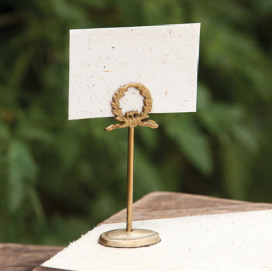 Antique brass laurel wreath place card holder from the Southern Classic Collection; available in 2" and 3" sizes.