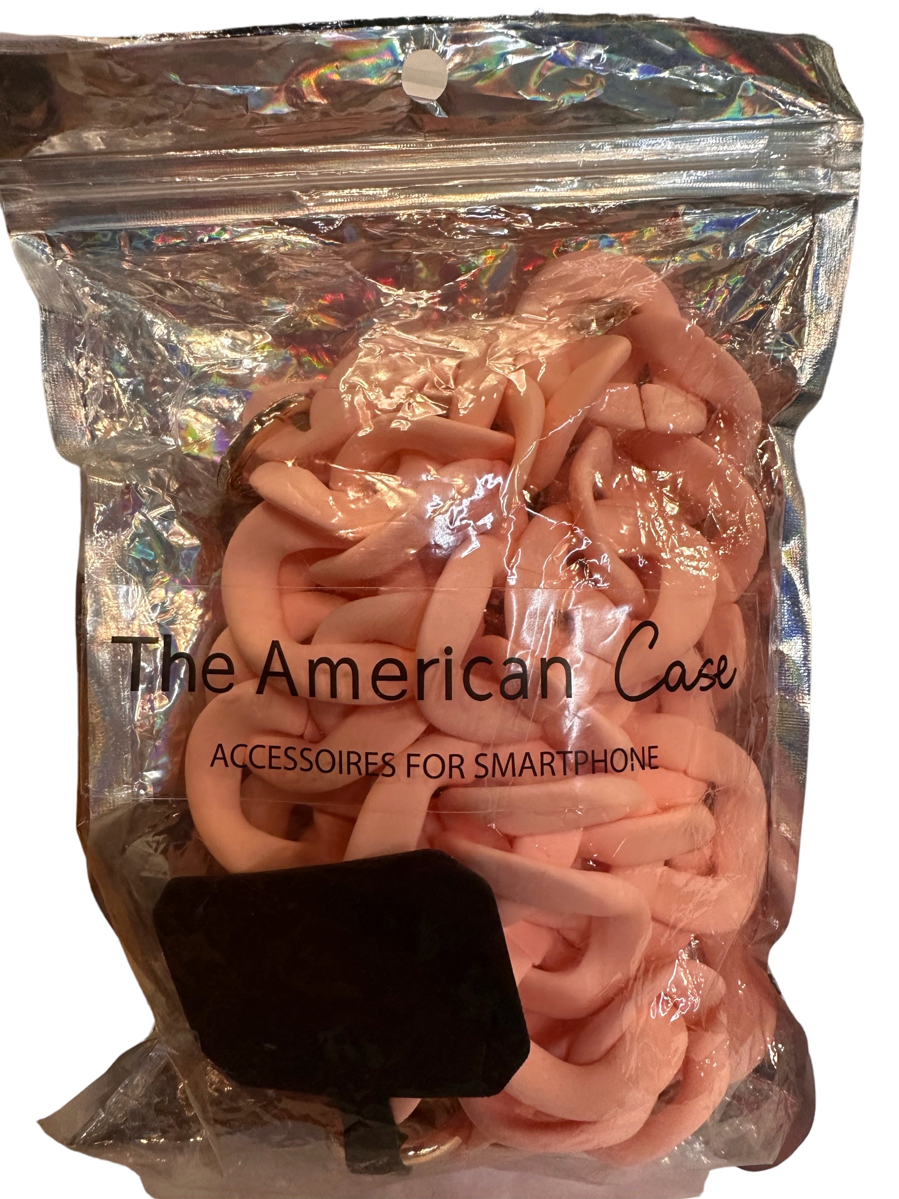 This product is a clear, shiny plastic bag named "the american case, accessories for smartphone." The bag contains pink rubbery accessories such as phone cases and Adjustable Crossbody Phone Straps. These cases and straps are tangled together inside the bag.