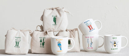The product is a range of canvas bags, sturdy and durable for everyday use. Available in various sizes to accommodate different needs. Accompanying the bags are 4-inch Stoneware Mugs, decorated with charming garden prints. The mugs display excellent craftsmanship, with a comfortable grip and glossy finish, suitable for hot or cold beverages.