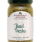 Glass jar of Basil Pesto, green lid, labeled "Basil Pesto," with parmesan cheese. Gluten Free, Non GMO. Net Weight: 227g (8 oz).