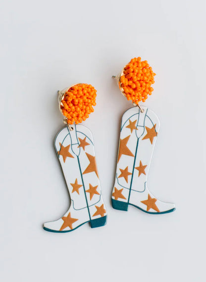 Orange beaded studs with dangling white cowboy boots, orange stars, blue accents. Sizes available: one size fits all.