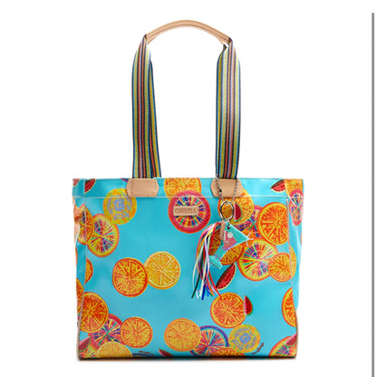 Journey Tote, Cha Cha: turquoise with citrus patterns, rainbow straps, tassel keychain, zipper pocket. Sizes: Small, Large.