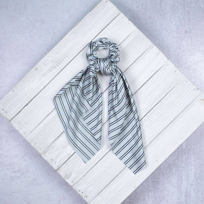 Striped Hair Scrunchie Scarves in pink, navy, light blue, and black with attached scarf ribbons. Available in one size.