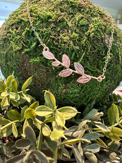 The Brady Necklace features delicate gold branches and leaf details. Available in 16", 18", and 20" lengths.